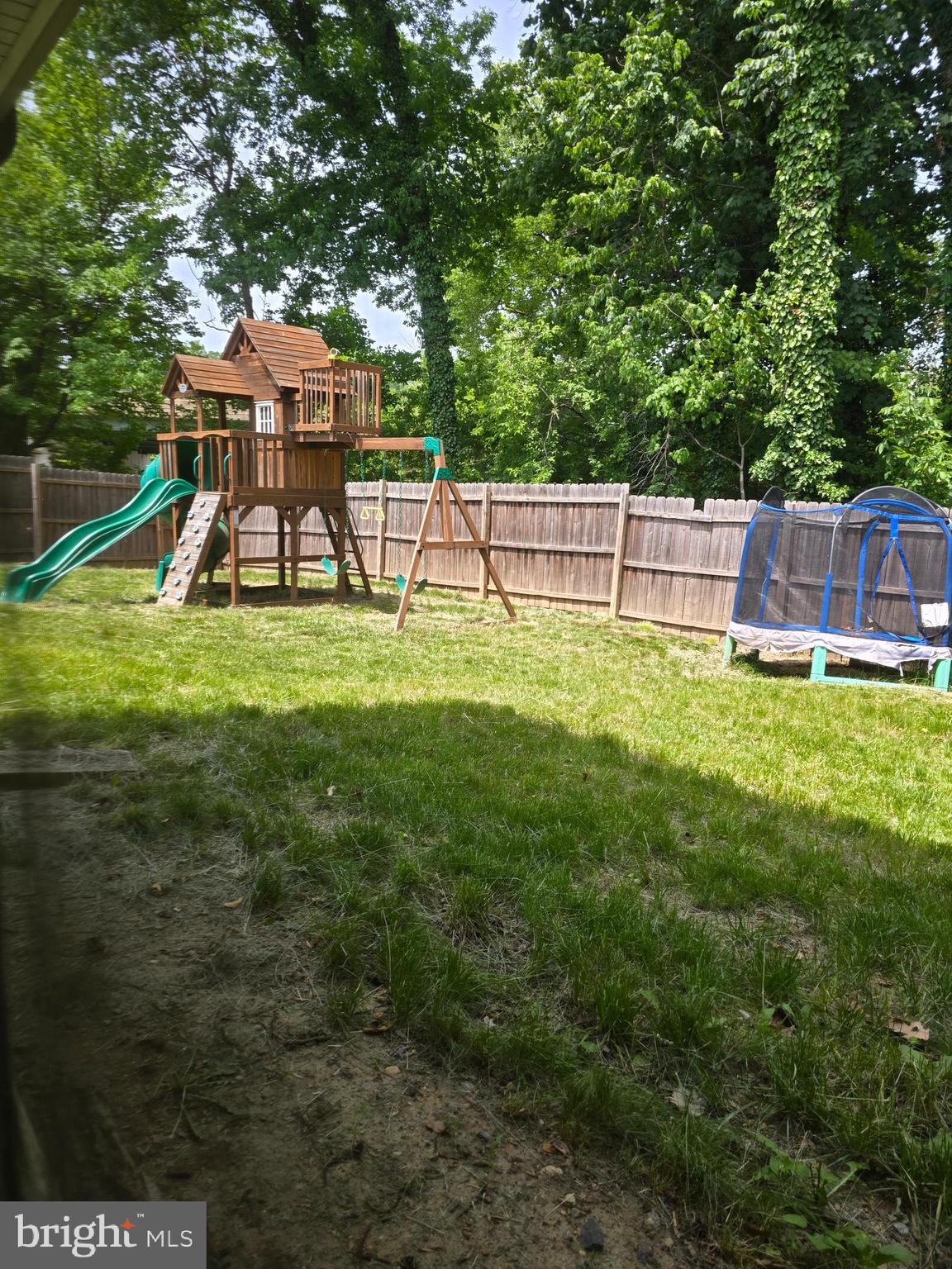 55 Miles Road Claymont, DE 19703 - Photo 4 of 16 Rear yard/playhouse