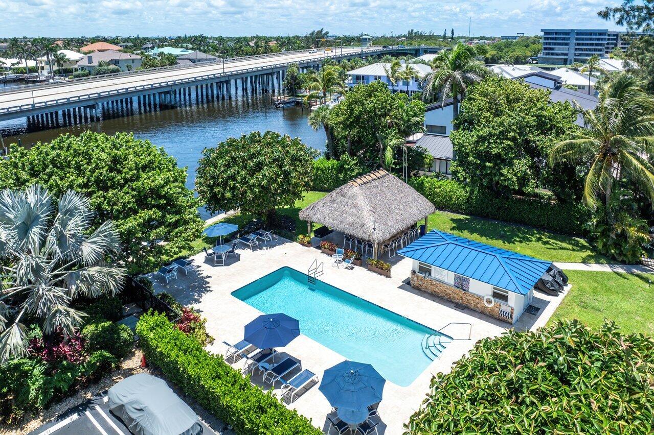 1700 South Ocean Boulevard, Unit 7 Delray Beach, FL 33483 - Photo 1 of 37 a view of a swimming pool with lounge chair