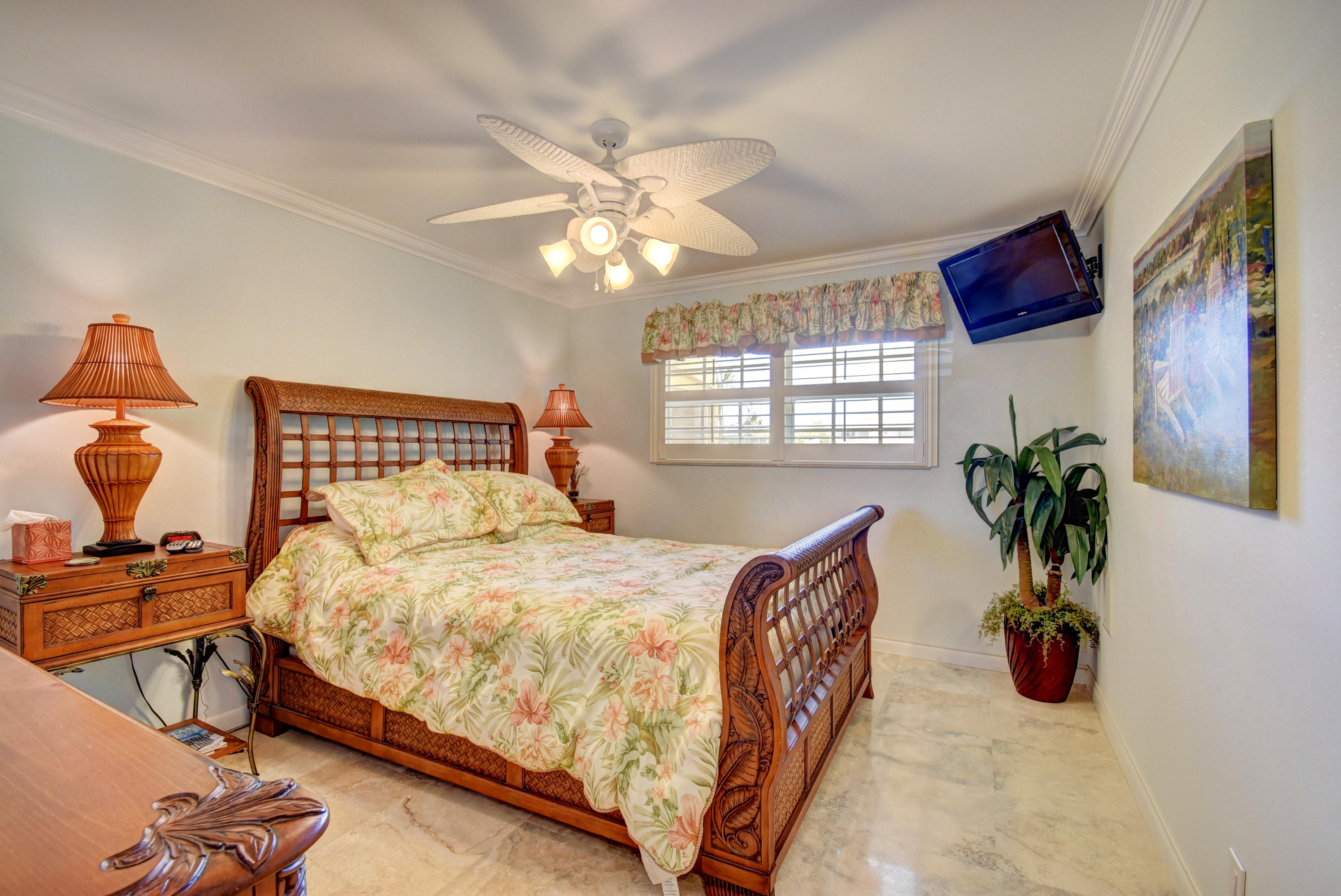 1700 South Ocean Boulevard, Unit 7 Delray Beach, FL 33483 - Photo 17 of 37 a bedroom with a bed and a potted plant