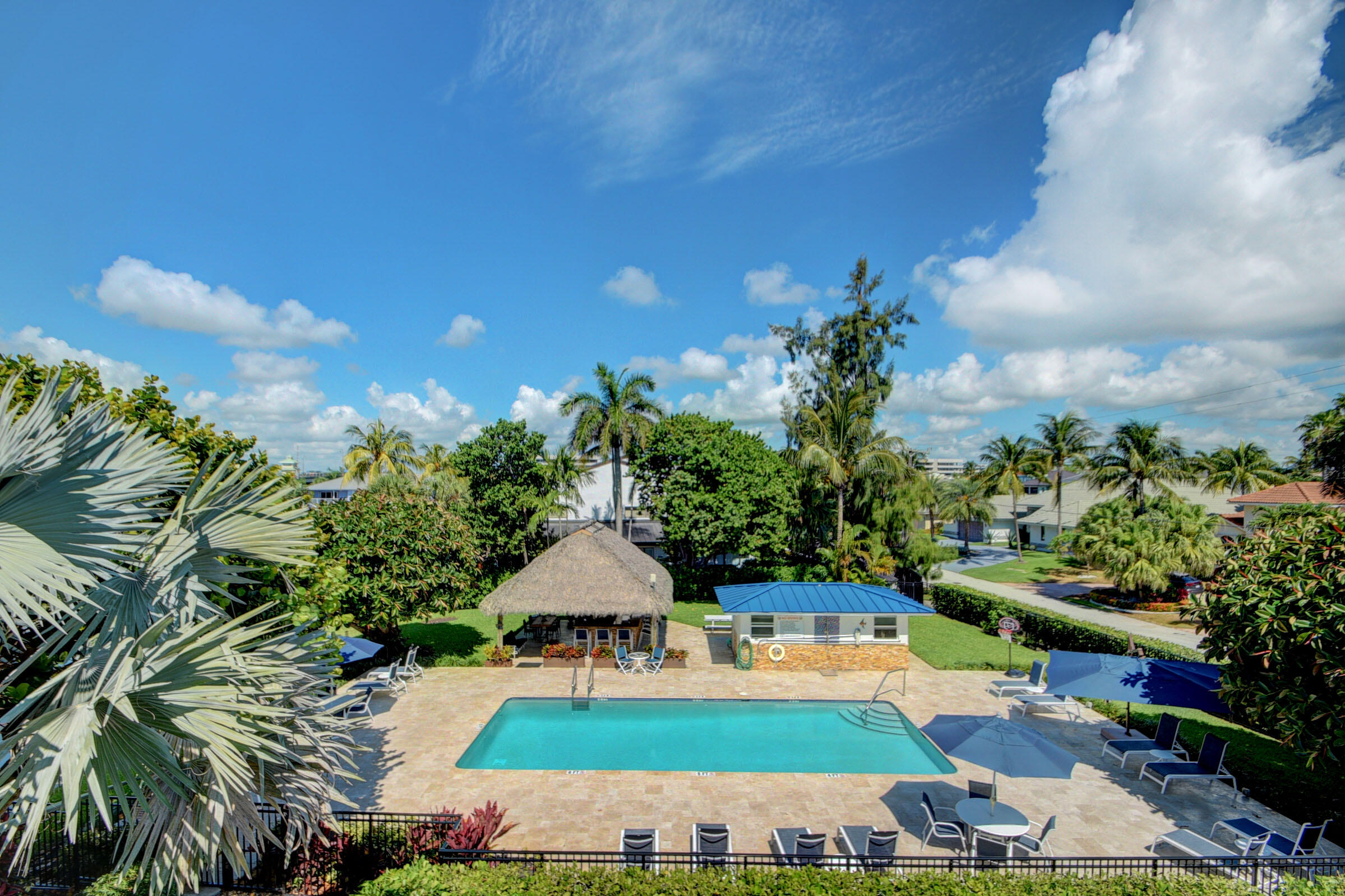1700 South Ocean Boulevard, Unit 7 Delray Beach, FL 33483 - Photo 20 of 37 a view of yard with swimming pool outdoor seating and barbeque oven in the back