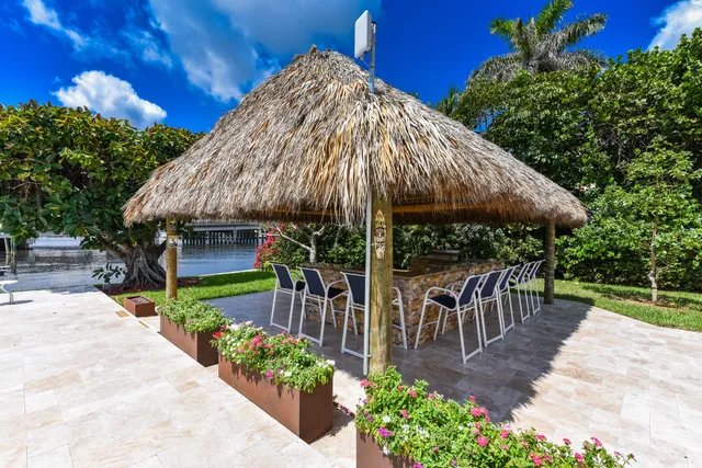 a view of a backyard with sitting area