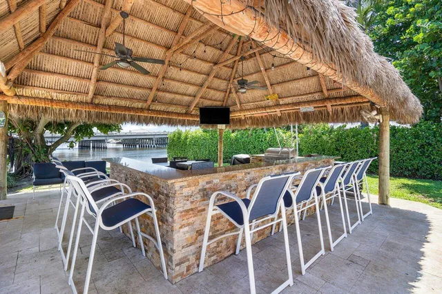 a patio with a table and chairs