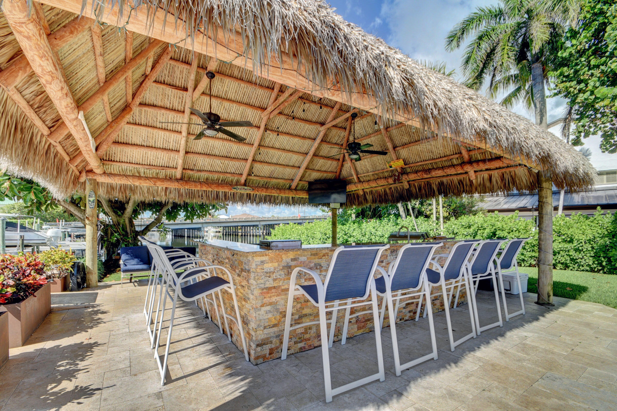 1700 South Ocean Boulevard, Unit 7 Delray Beach, FL 33483 - Photo 29 of 37 a patio with a table and chairs