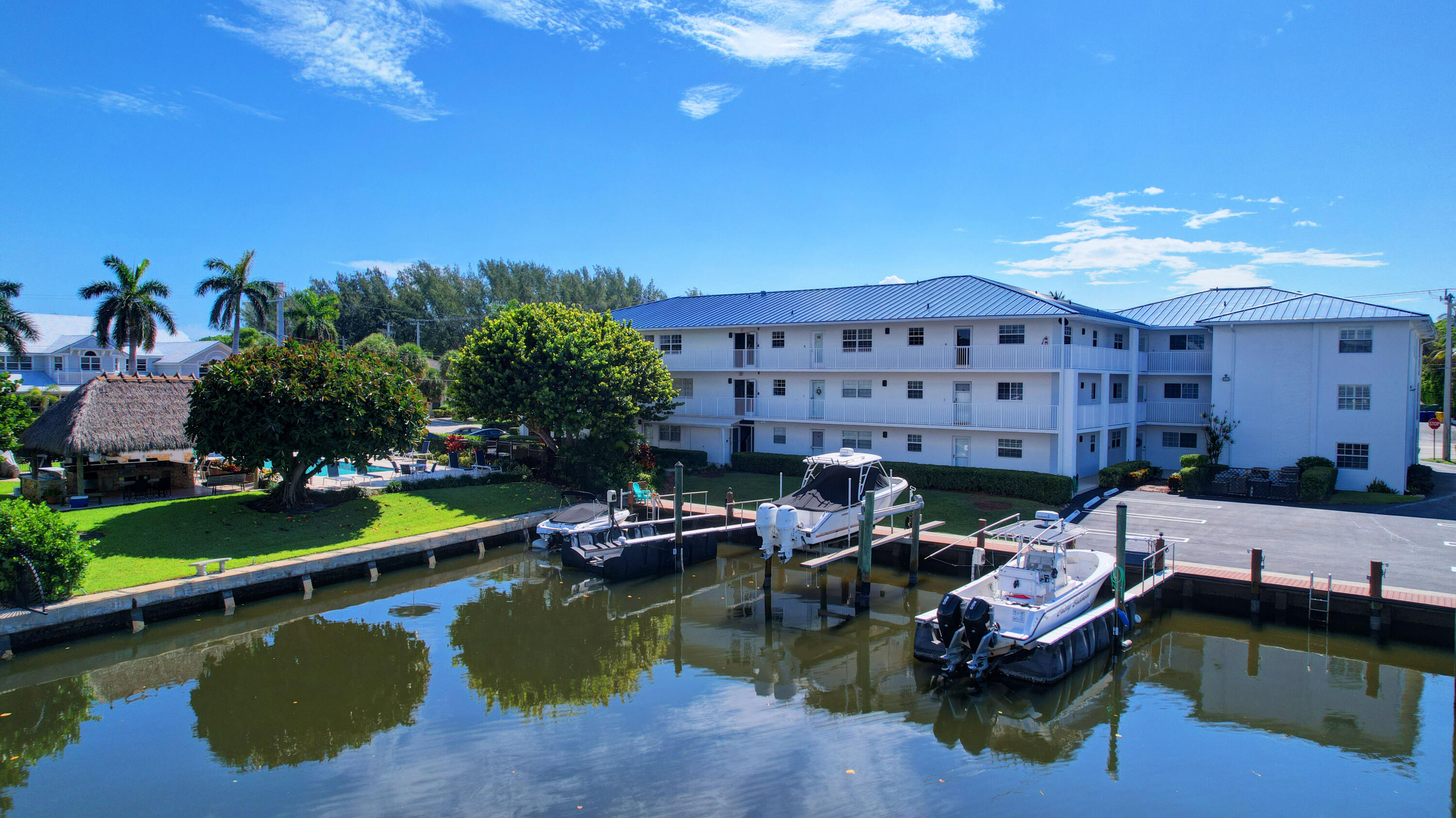 1700 South Ocean Boulevard, Unit 7 Delray Beach, FL 33483 - Photo 30 of 37 a view of a house with pool and chairs