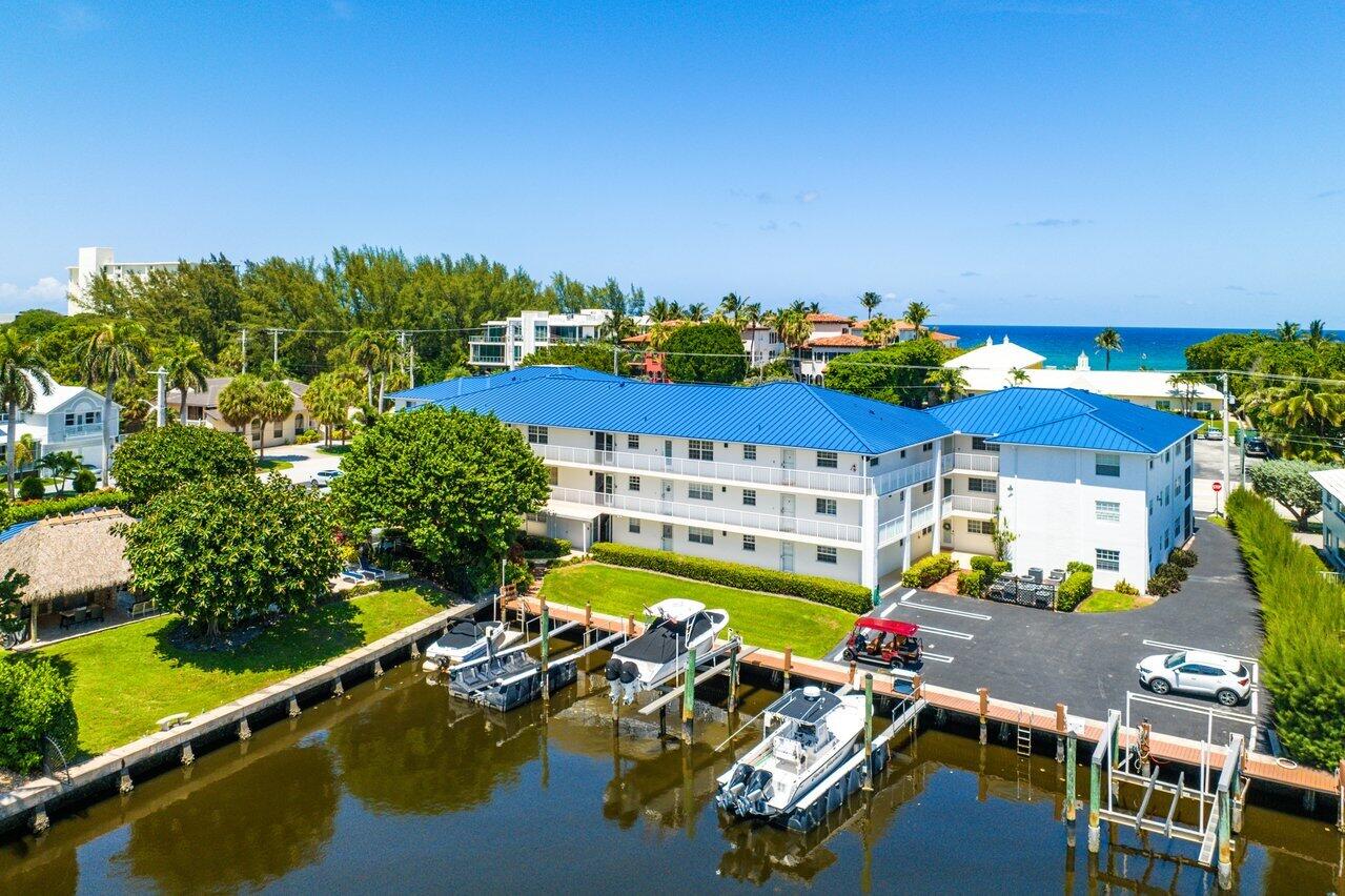 1700 South Ocean Boulevard, Unit 7 Delray Beach, FL 33483 - Photo 31 of 37 a view of a swimming pool and lounge chair