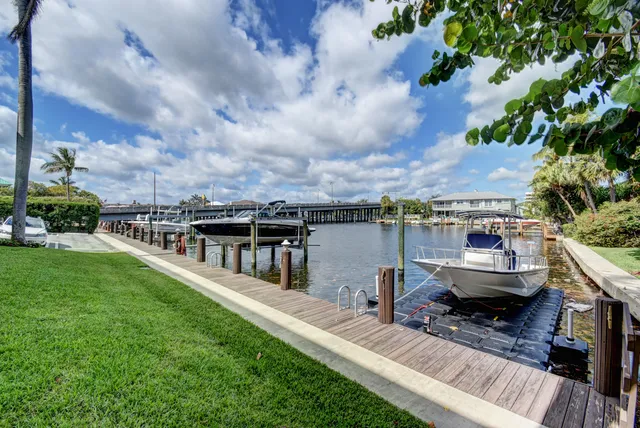 a view of a lake with a house in the background