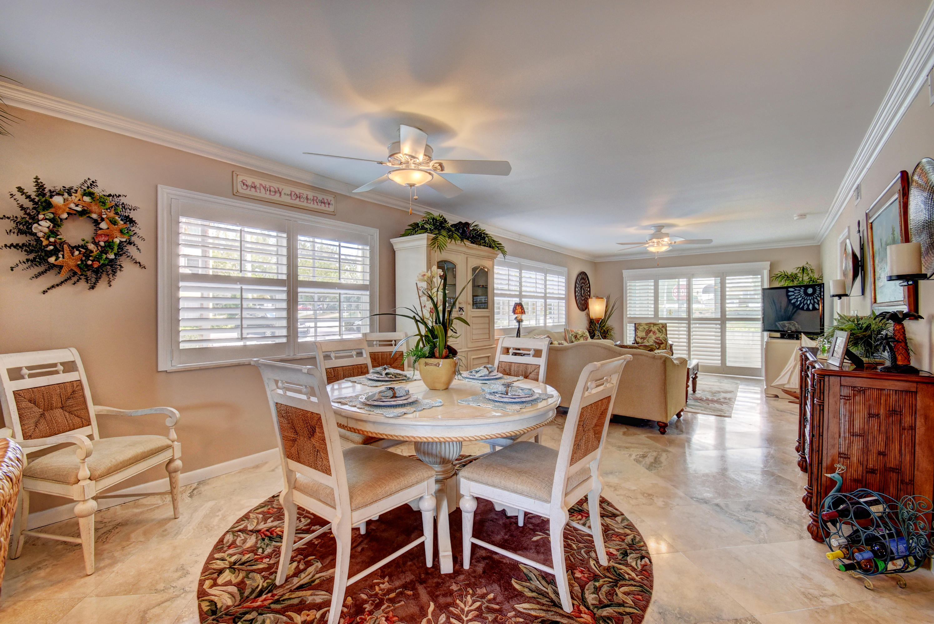 1700 South Ocean Boulevard, Unit 7 Delray Beach, FL 33483 - Photo 9 of 37 a view of a dining room with furniture and wooden floor