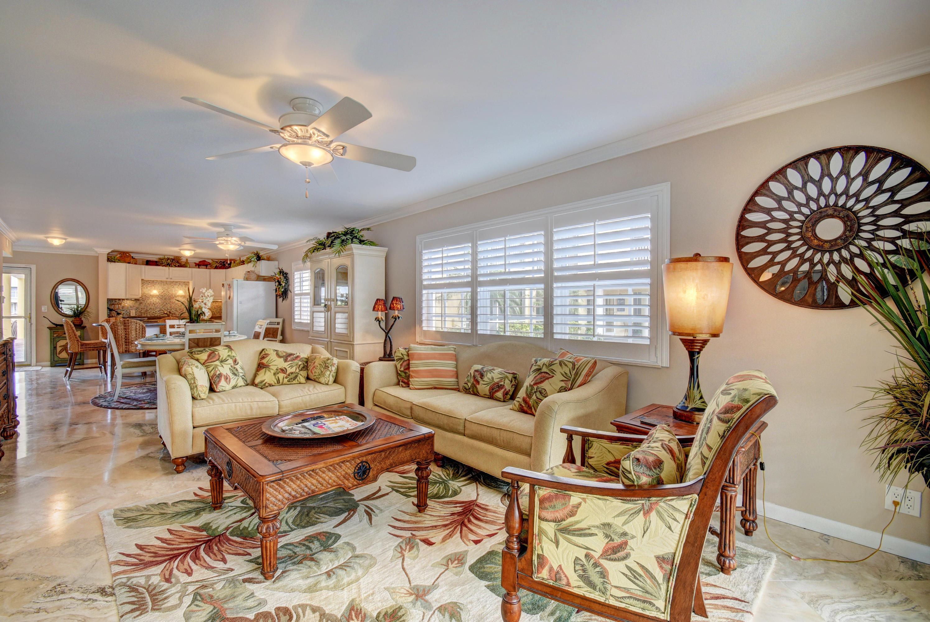 1700 South Ocean Boulevard, Unit 7 Delray Beach, FL 33483 - Photo 10 of 37 a living room with furniture a lamp and a large window