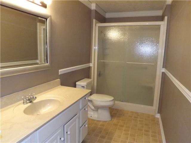 165 Mortons Lake Road Manchester, TN 37355 - Photo 14 of 18 The hall bath is conveniently located near the bedrooms. It features a large vanity and walk-in shower.