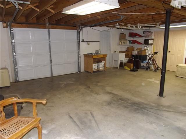 165 Mortons Lake Road Manchester, TN 37355 - Photo 17 of 18 This is a view of the drive-in basement garage. Great for equipment, storage/workshop. It also has a walk out door and utility sink.