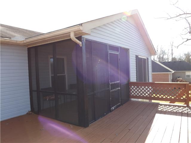165 Mortons Lake Road Manchester, TN 37355 - Photo 18 of 18 A large deck is connected to the screened deck and is perfect for entertaining.