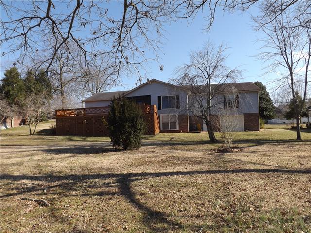 165 Mortons Lake Road Manchester, TN 37355 - Photo 2 of 18 This is a view of the back of the house from the backyard. Notice the extra large deck and drive-in basement area.