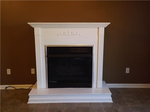 165 Mortons Lake Road Manchester, TN 37355 - Photo 6 of 18 A gas fireplace creates a cozy atmosphere in the Gathering Room and Kitchen.