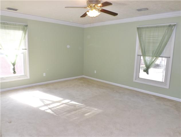 165 Mortons Lake Road Manchester, TN 37355 - Photo 10 of 18 The master bedroom features two sunny windows and a private bath.