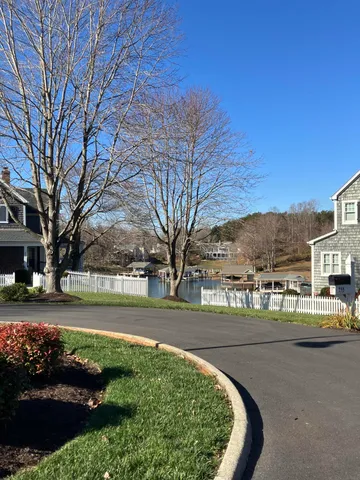 a view of a swimming pool and a yard