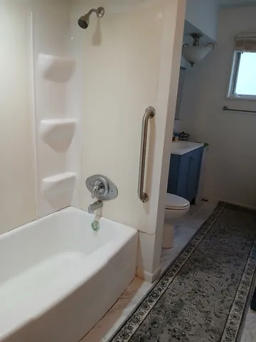 wooden floor and window in an empty room