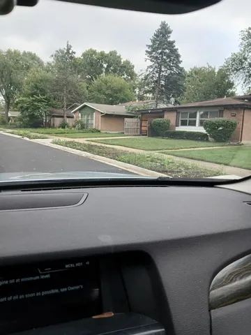 a kitchen with granite countertop a sink stove and cabinets