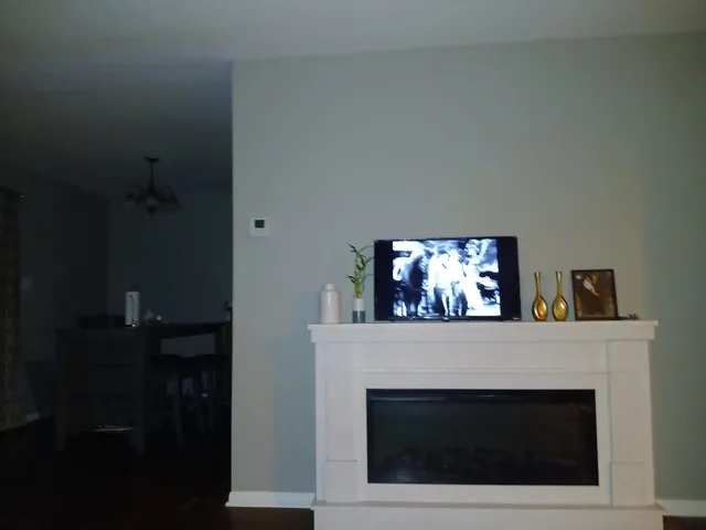 a bedroom with a bed and a table