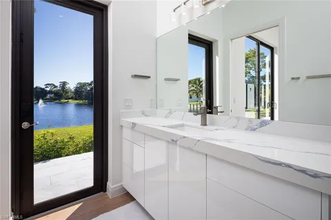 a bathroom with a double vanity sink and mirror