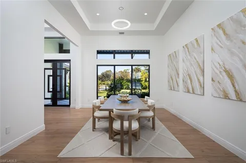 a dining room with furniture and window