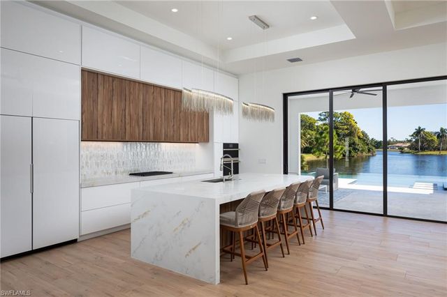 a kitchen with a table and chairs in it