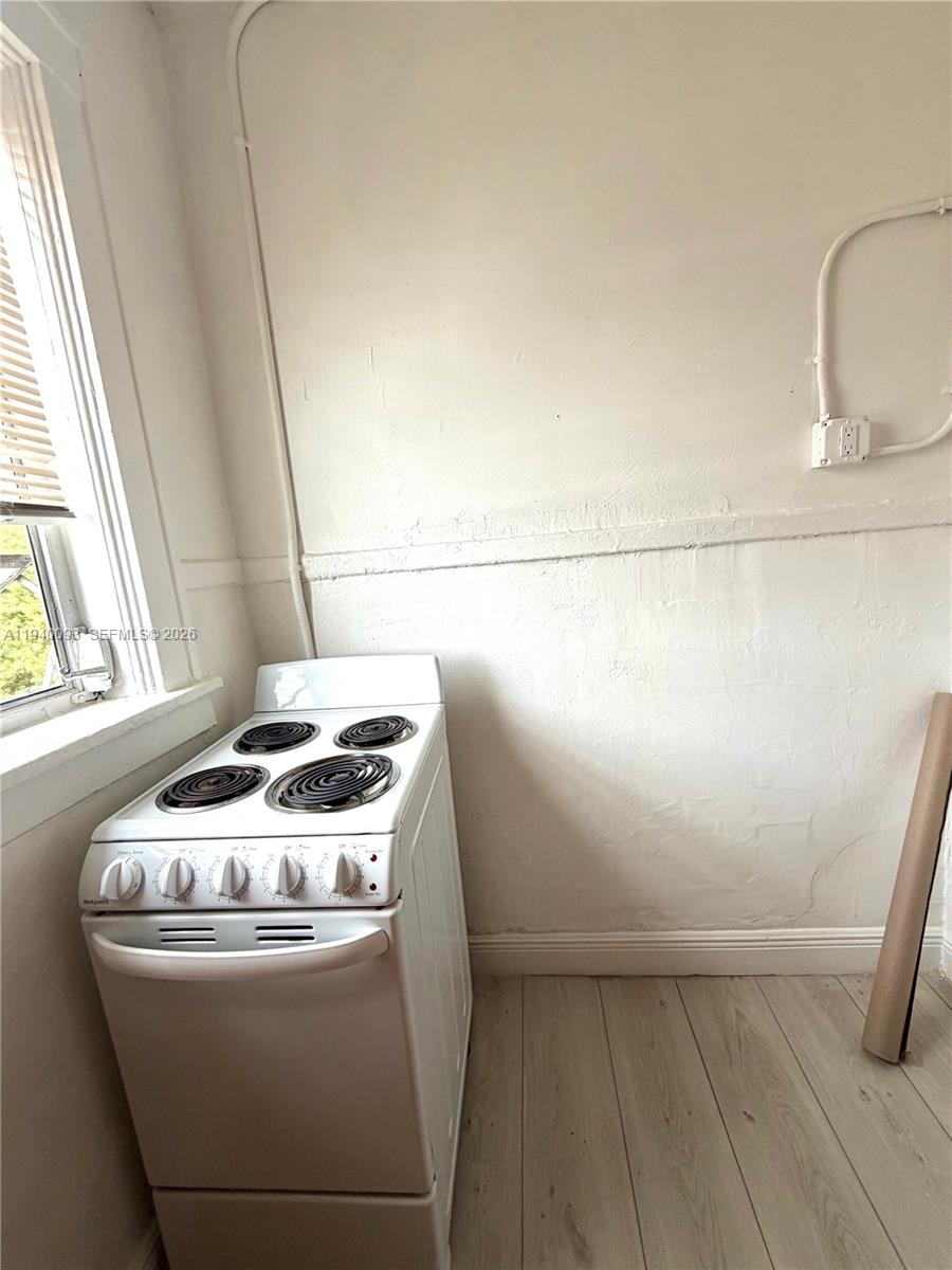 967 Southwest 5th Street, Unit 18 Miami, FL 33130 - Photo 6 of 12 a room with storage and utility