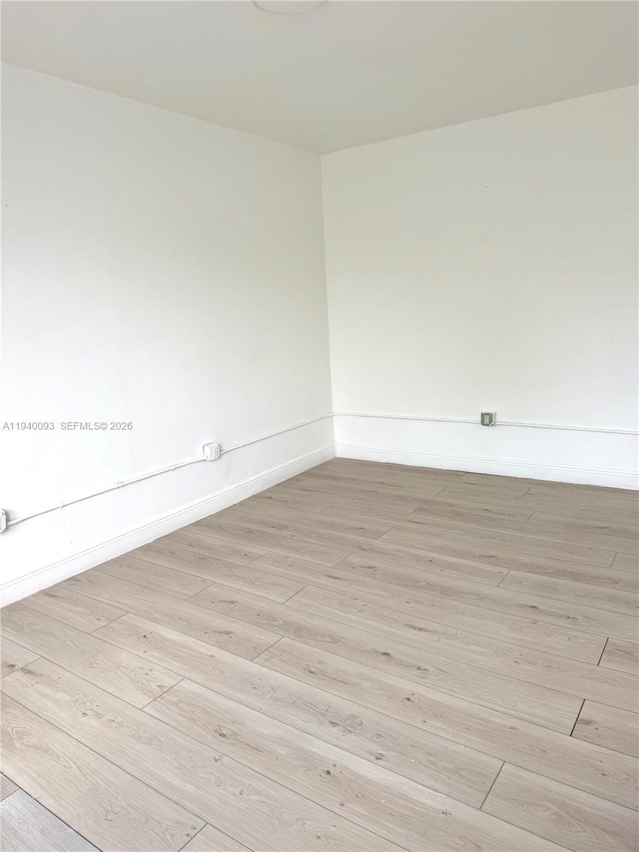 967 Southwest 5th Street, Unit 18 Miami, FL 33130 - Photo 7 of 12 wooden floor in a room