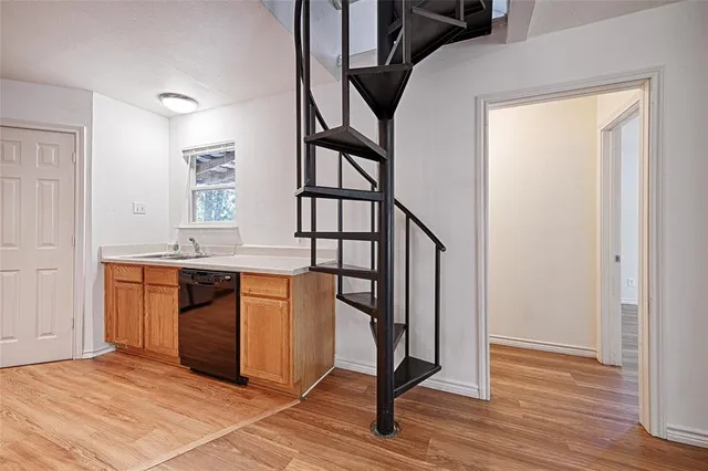 a view of entryway with wooden floor and stairs