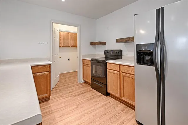 a kitchen with stainless steel appliances a refrigerator stove microwave and sink
