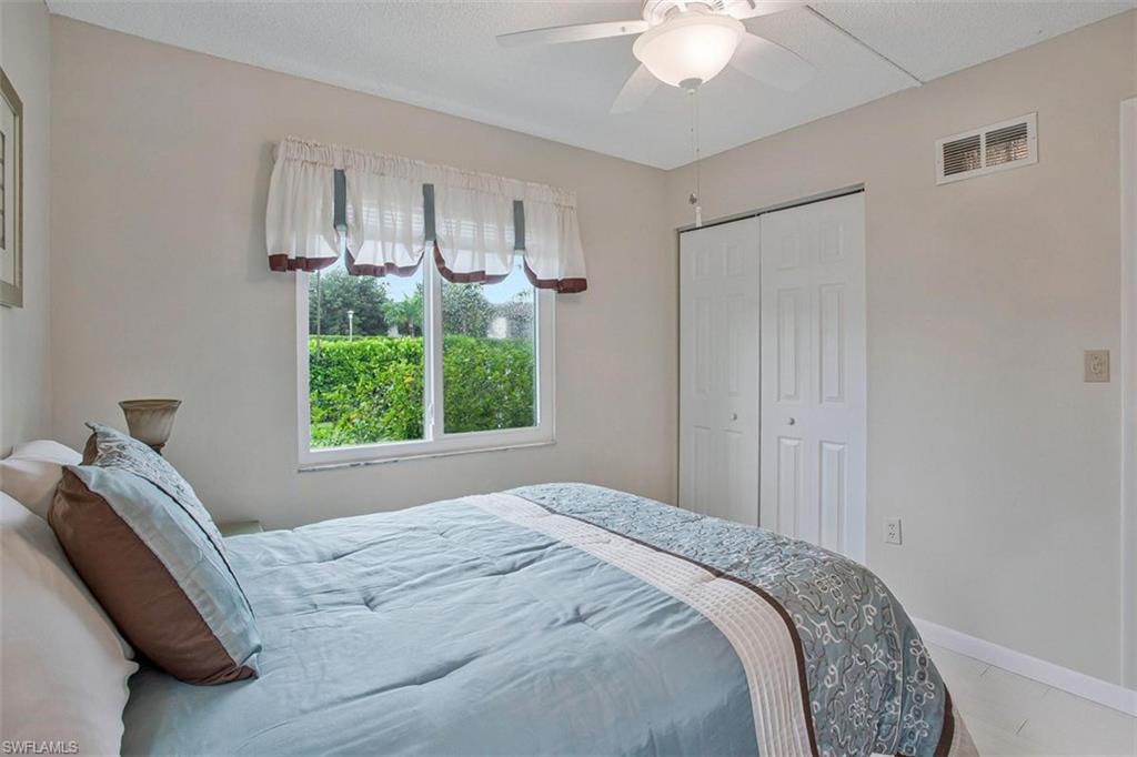 4258 27th Court Southwest, Unit 106 Naples, FL 34116 - Photo 5 of 19 Your guests will love their private bedroom with a closet and full bath nearby