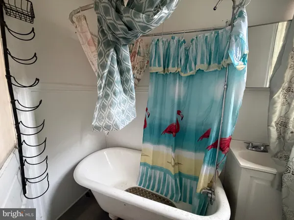 a view of a hallway with windows and closet