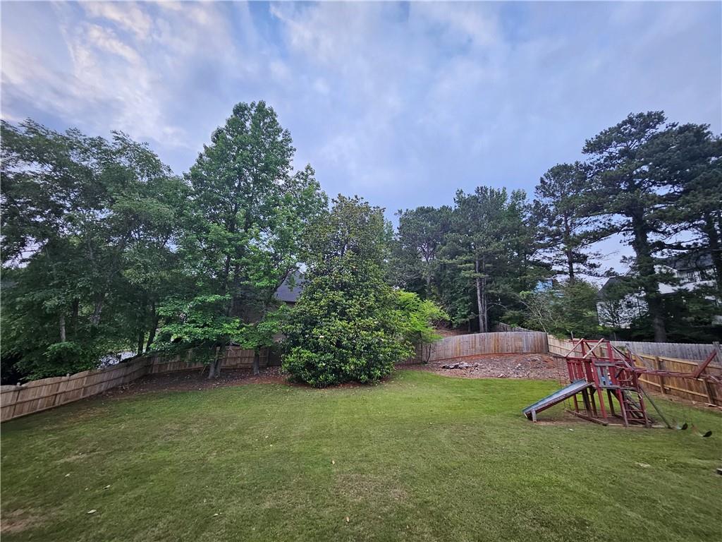 144 Hunters Trace Dallas, GA 30157 - Photo 34 of 34 a view of a backyard with sitting area
