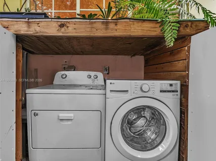 a view of a chairs and table in a backyard