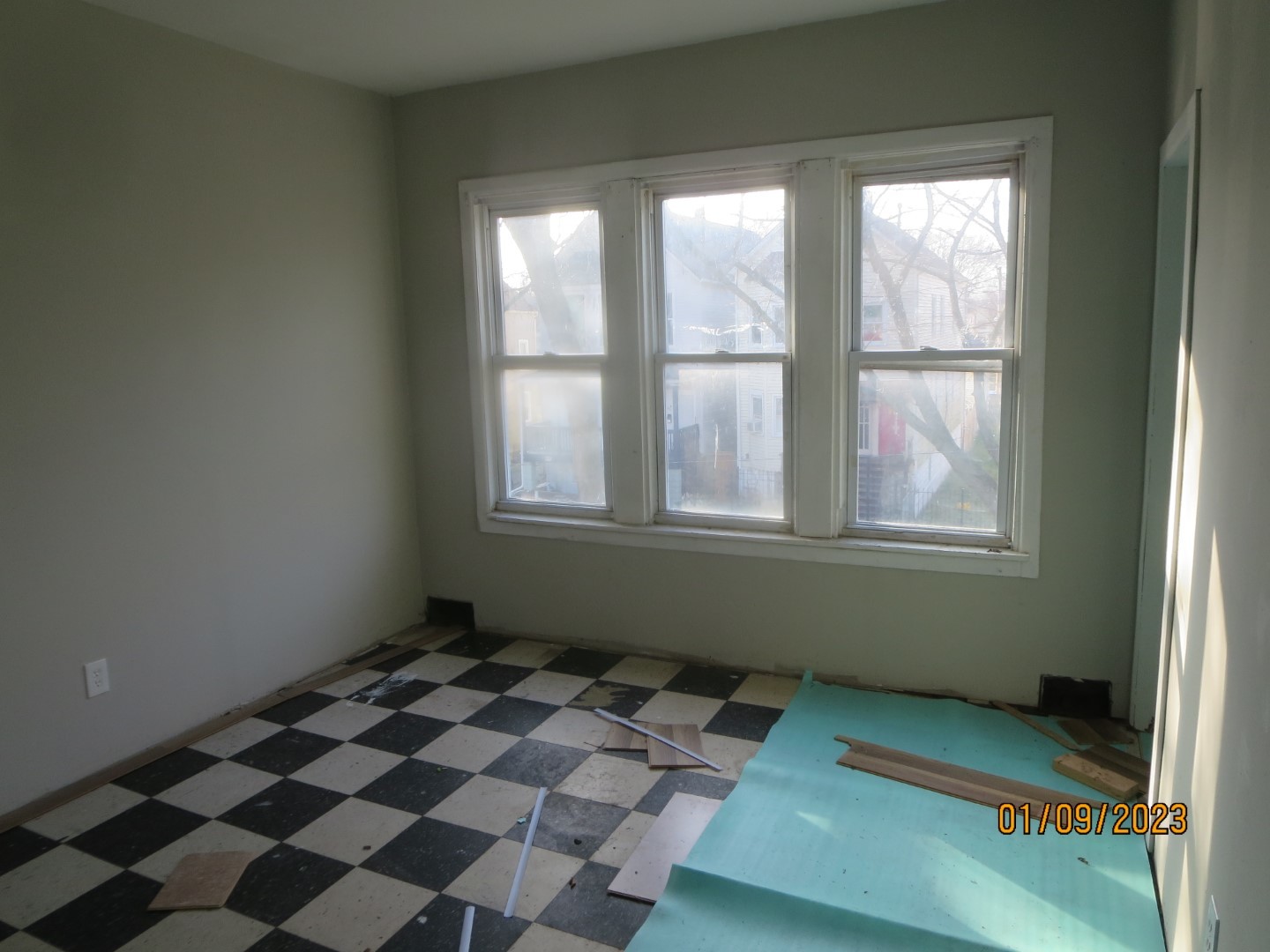 Undisclosed Address Chicago, IL 60617 - Photo 12 of 29 a bedroom with a bed and a window