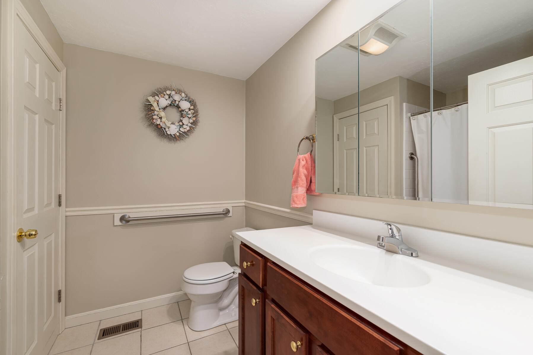 13 North Ridge Road Mashpee, MA 02649 - Photo 15 of 42 a bathroom with a sink a toilet and a mirror