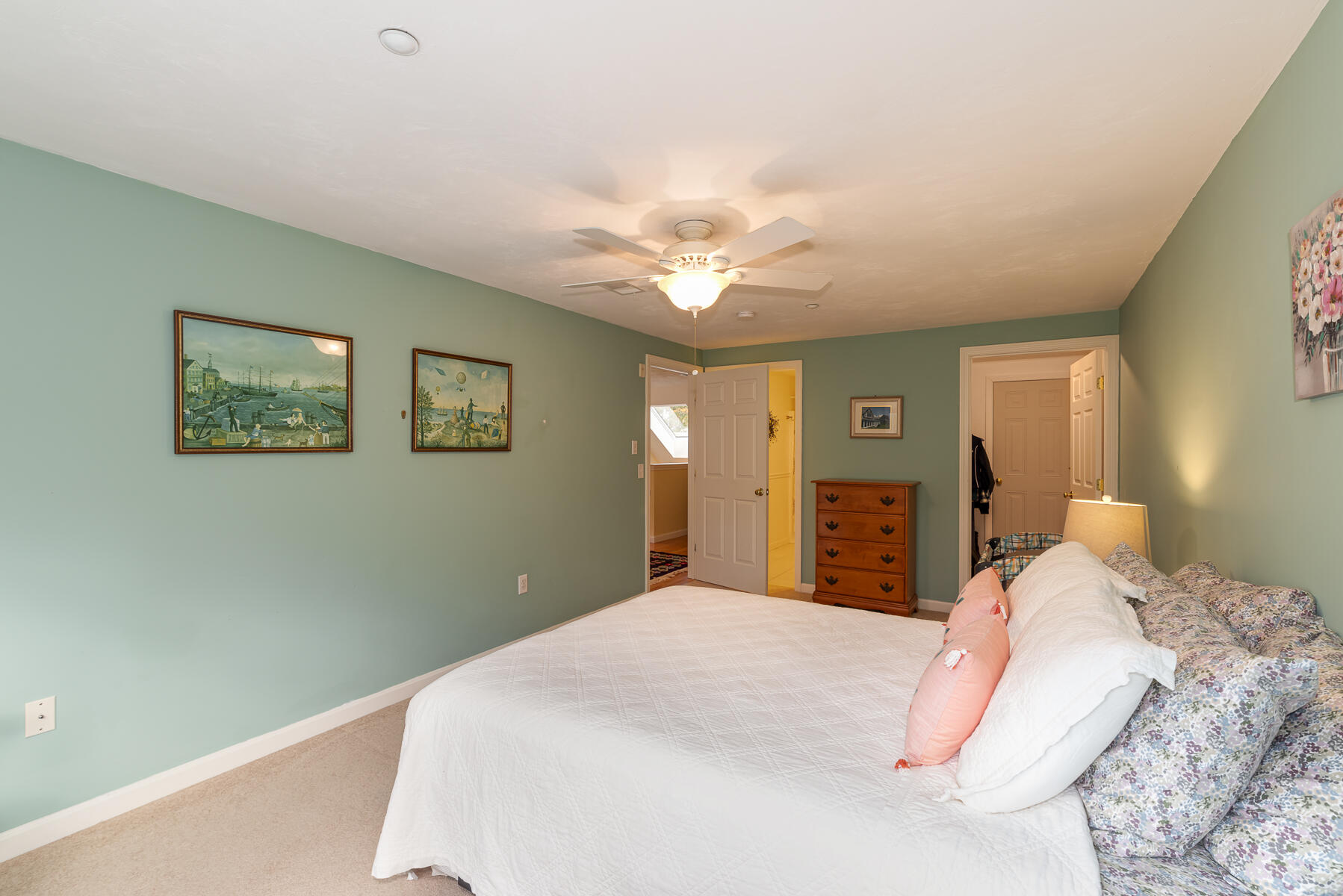 13 North Ridge Road Mashpee, MA 02649 - Photo 23 of 42 a bedroom with a large bed and a chandelier
