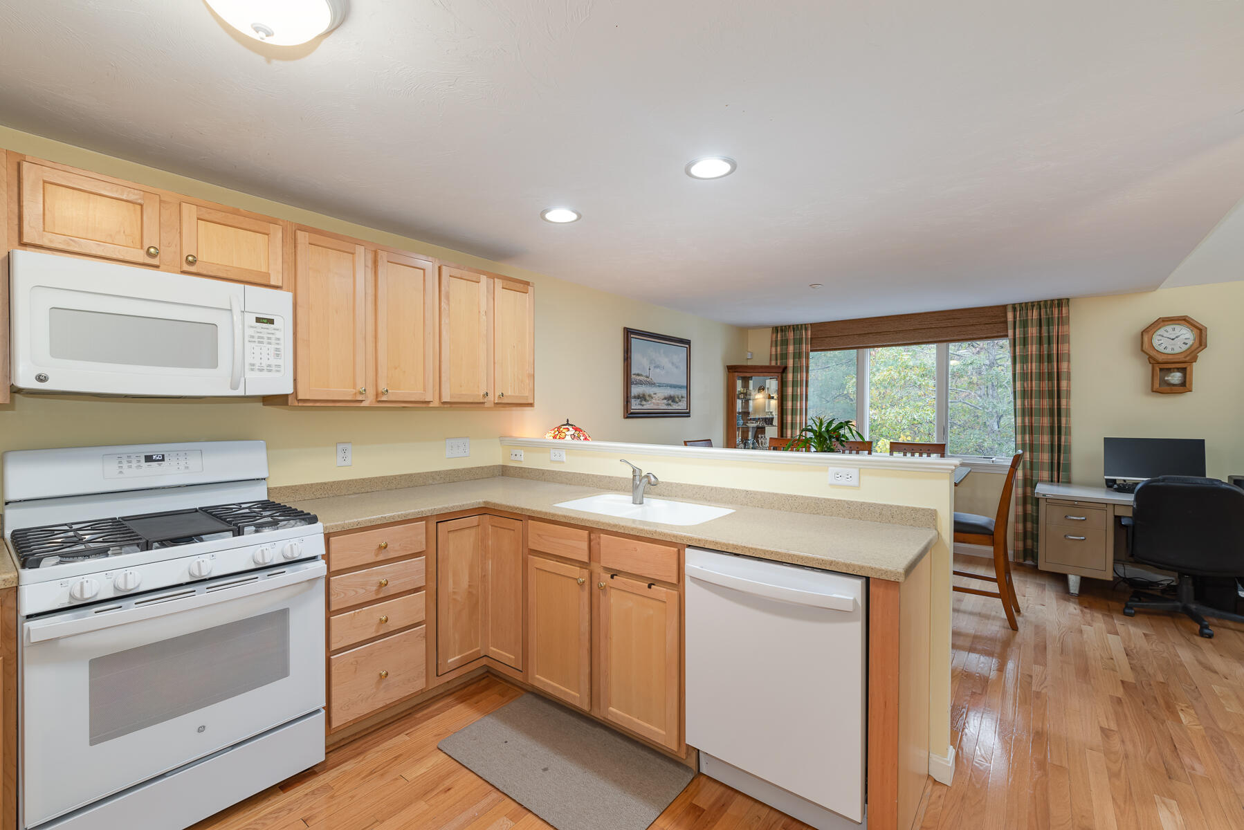 13 North Ridge Road Mashpee, MA 02649 - Photo 6 of 42 a kitchen with white cabinets and white appliances