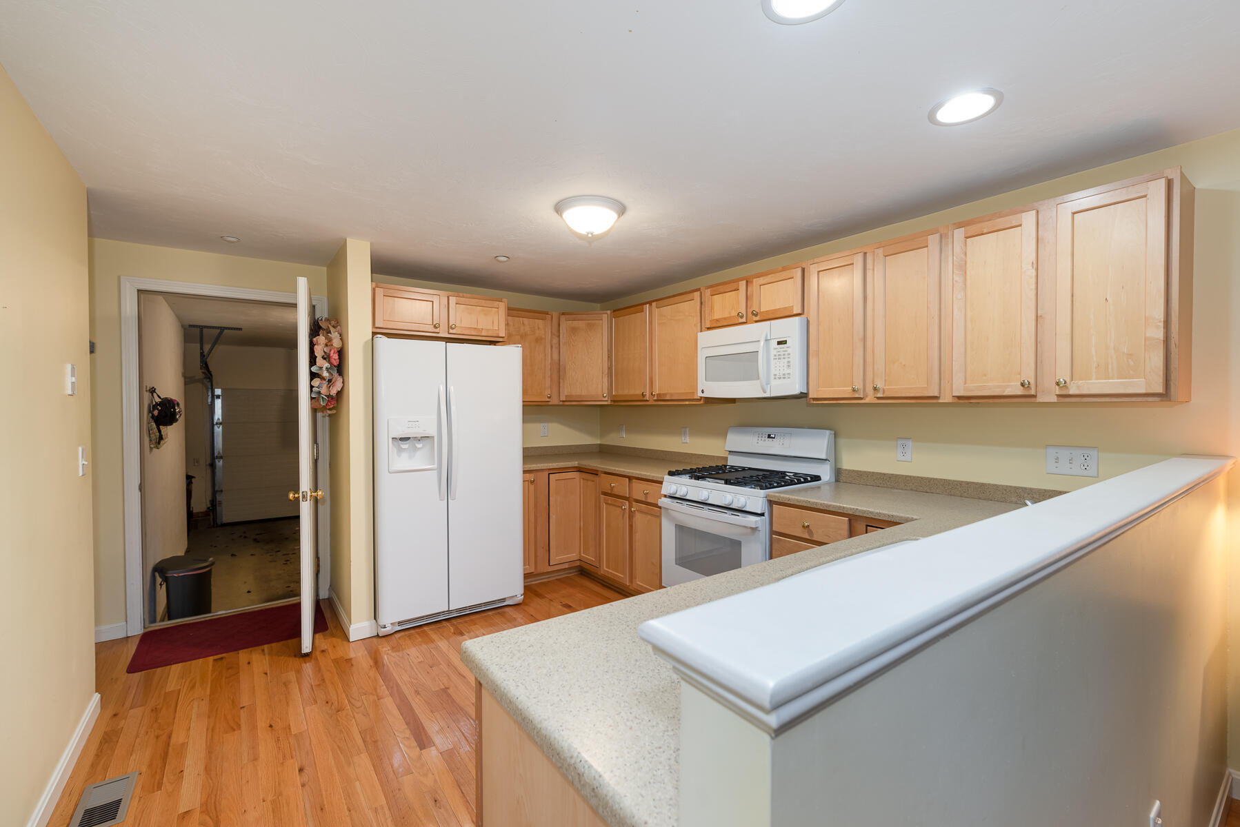 13 North Ridge Road Mashpee, MA 02649 - Photo 8 of 42 a kitchen with stainless steel appliances granite countertop a refrigerator a stove and a sink with large window
