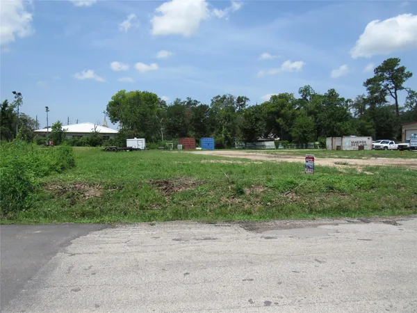a view of outdoor space with playground and green space