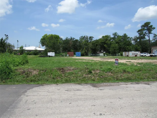a view of outdoor space with playground and green space