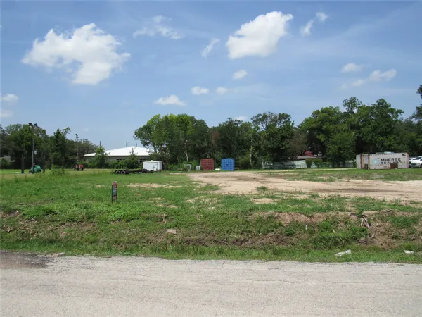 a view of outdoor space with garden and trees