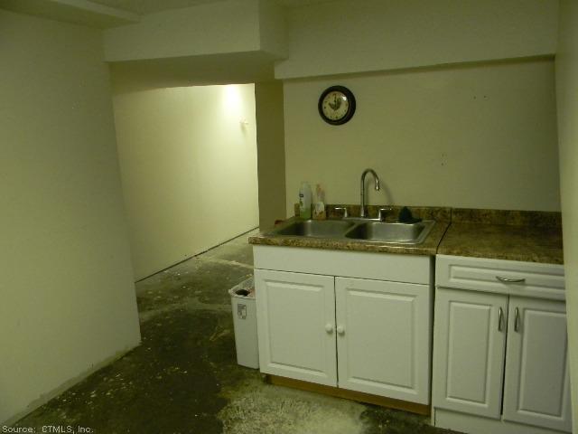 60 Jarvis Road Manchester, CT 06040 - Photo 1 of 1 a bathroom with a sink and a mirror