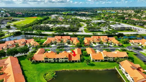 an aerial view of residential houses with outdoor space and river