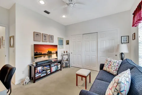 a kitchen with stainless steel appliances kitchen island granite countertop a stove top oven a sink a dining table and chairs
