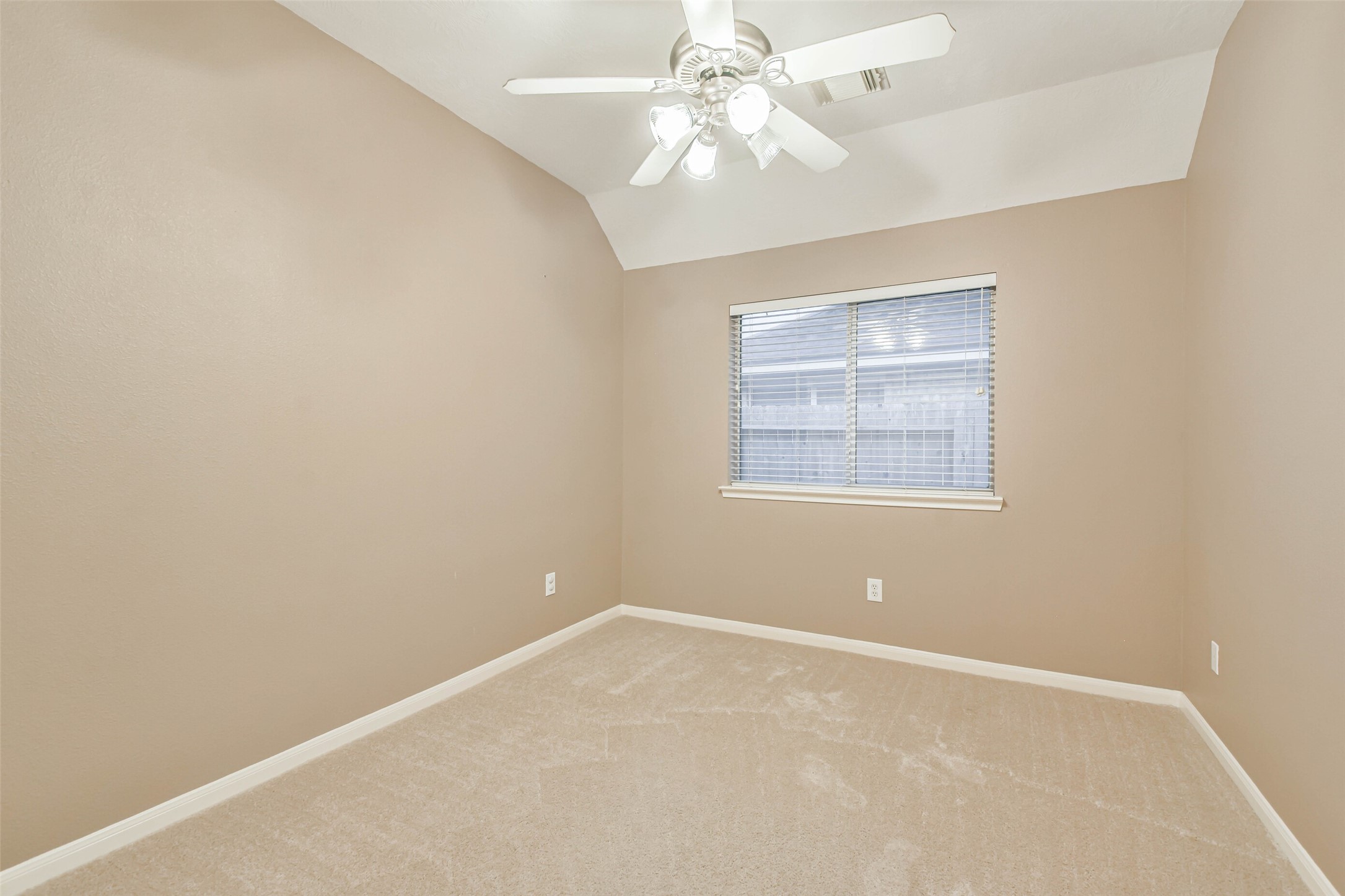 20942 Wind Field Lane Spring, TX 77379 - Photo 34 of 46 an empty room with a window and a fan