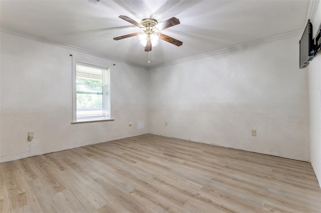 1590 Farm Road 2352 Sumner, TX 75486 - Photo 10 of 40 wooden floor in an empty room with a window