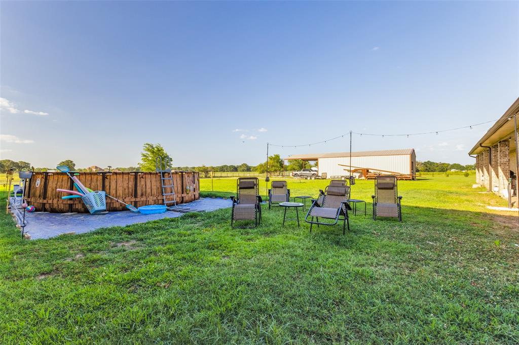 1590 Farm Road 2352 Sumner, TX 75486 - Photo 36 of 40 a group of people sitting in a yard