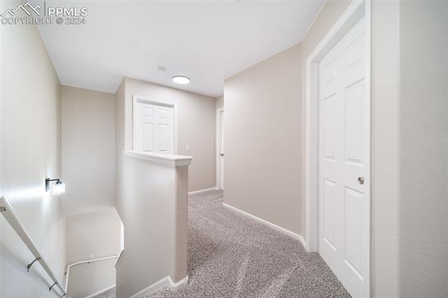 9356 Bethpage Road Peyton, CO 80831 - Photo 19 of 40 Corridor featuring carpet flooring