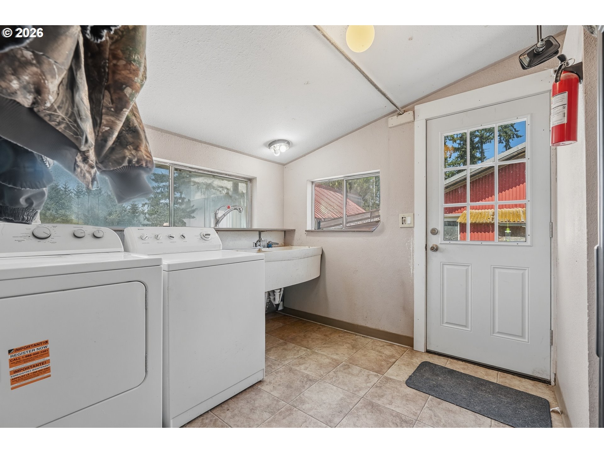68763 Wasser Road Rainier, OR 97048 - Photo 9 of 42 a room with a sink cabinets and utility