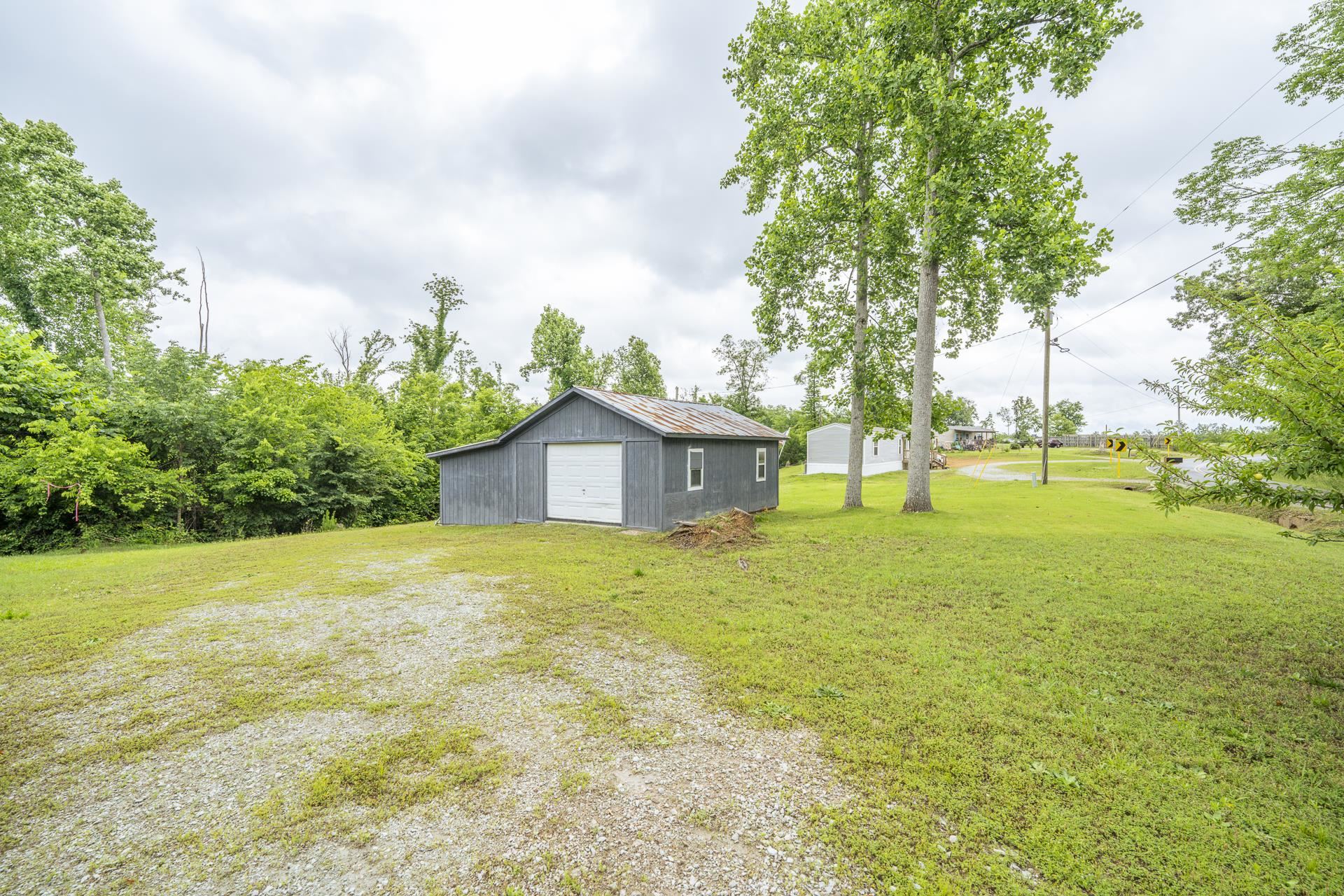3275 Glendale Road Adamsville, TN 38310 - Photo 9 of 39 a big yard with large trees
